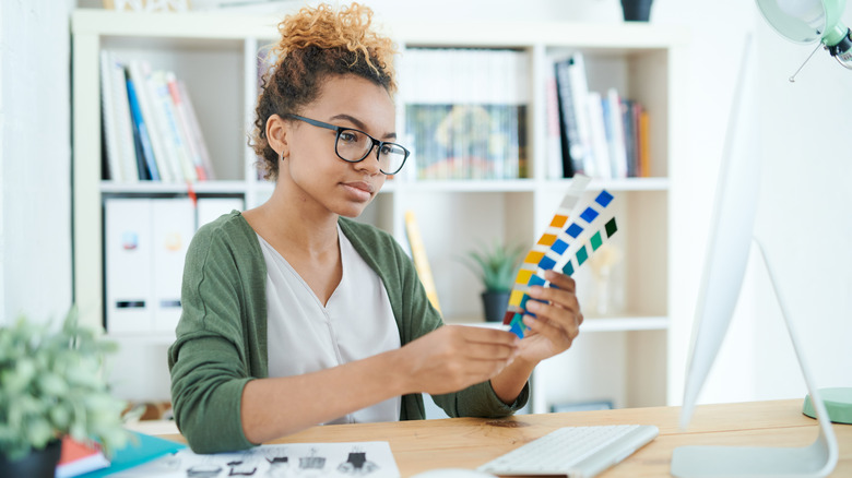 woman looking at color swatches