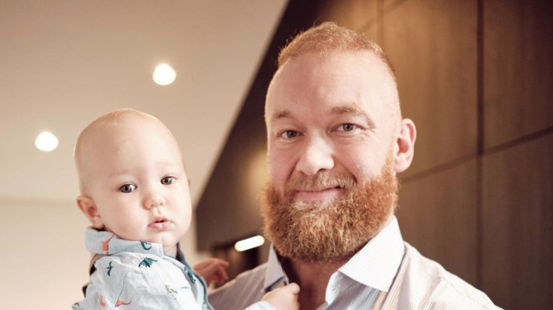 Hafþór Júlíus Björnsson with baby in house