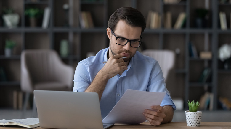 man sitting at desk