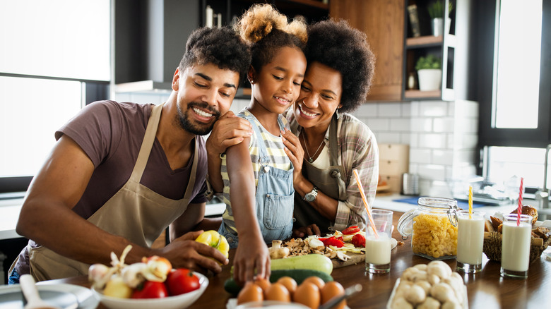 happy family cooking in kitchen