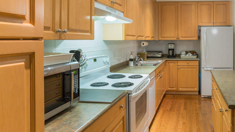 Corner of kitchen with cabinets