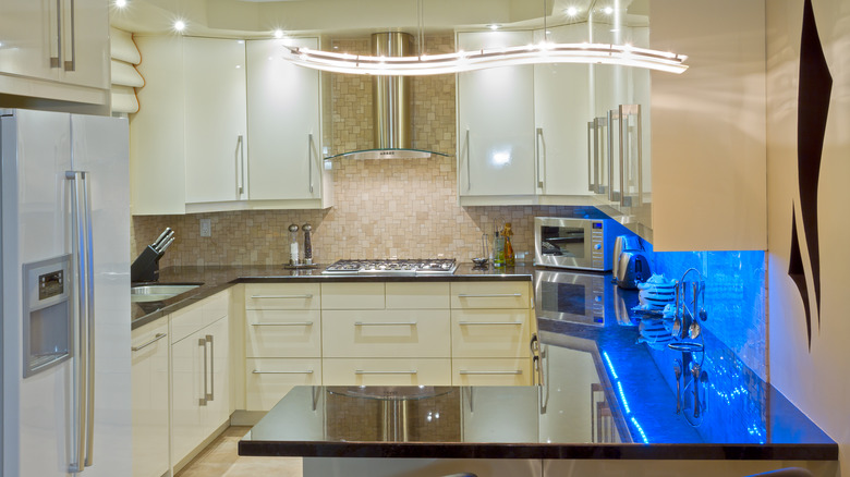 White kitchen with black countertops