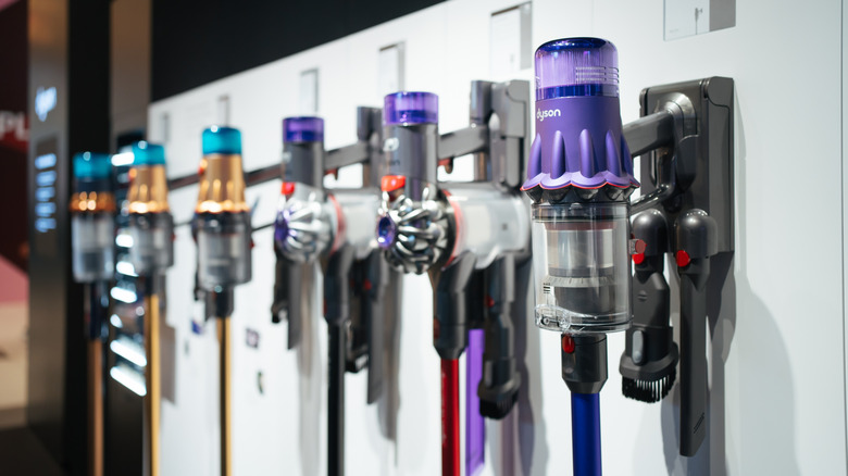 Several Dyson vacuum cleaners on display