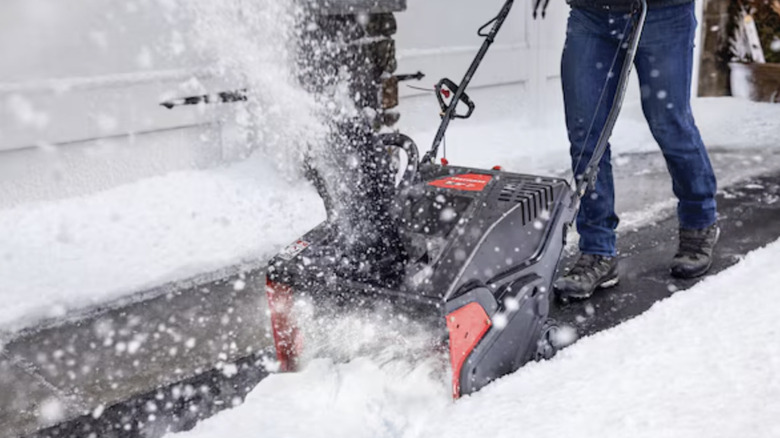 Person uses Craftsman SB230 snow blower