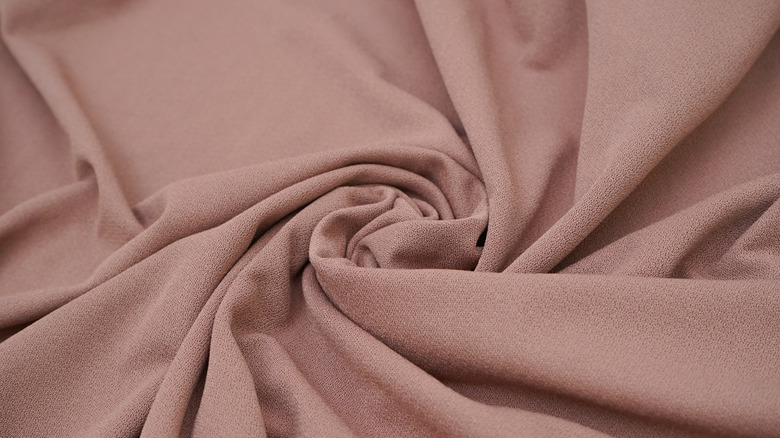 Polyester fabric swirled on background