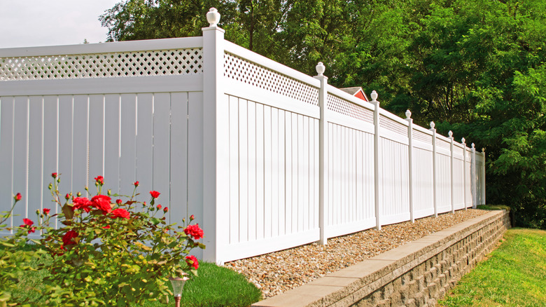 White vinyl fence around home