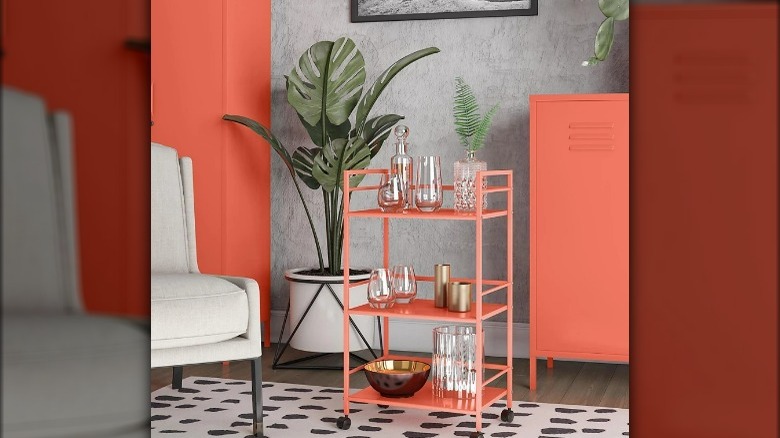 Bright orange metal bar cart