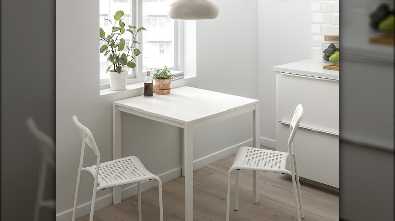 White plastic kitchen chairs