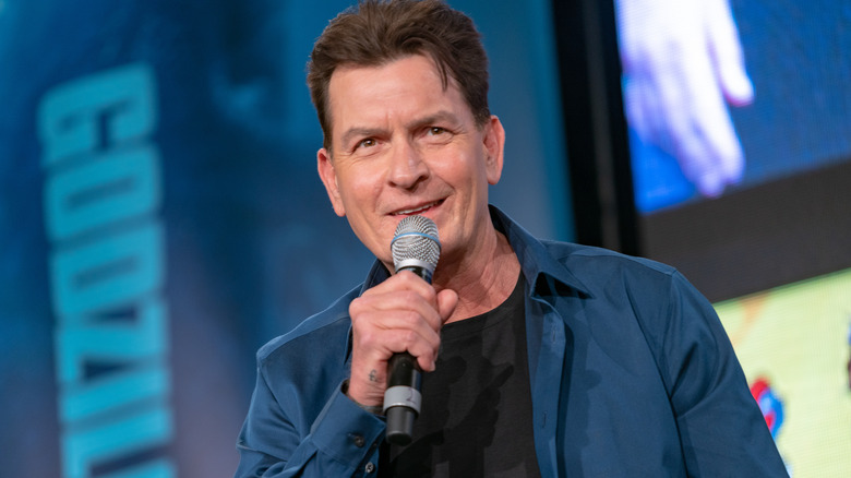 charlie sheen holding microphone