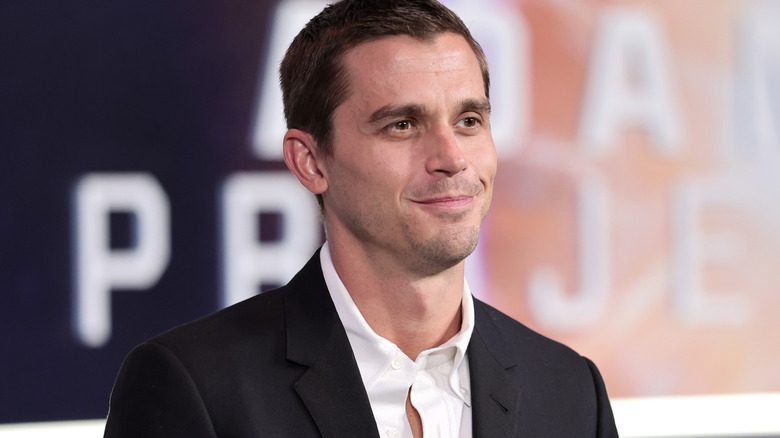 Antoni Porowski smirking