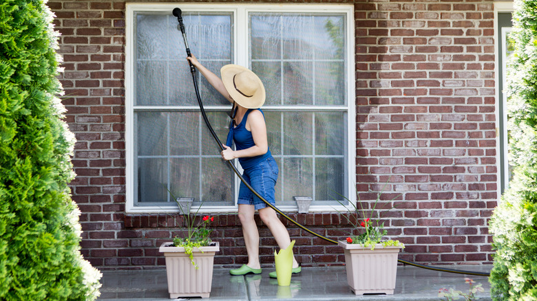 Cleaning windows with hose