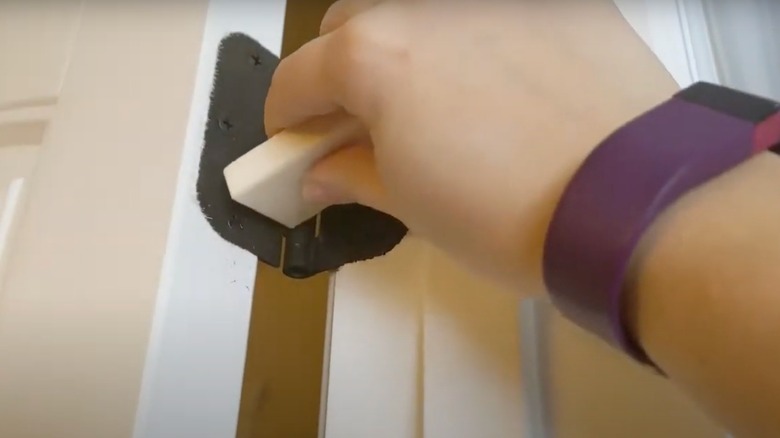 Rubbing bar soap on door hinge