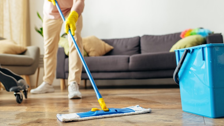 person cleaning floor