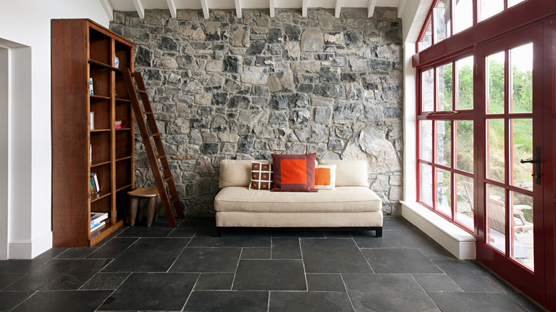 Photo of a sofa on a tile floor in a sitting area