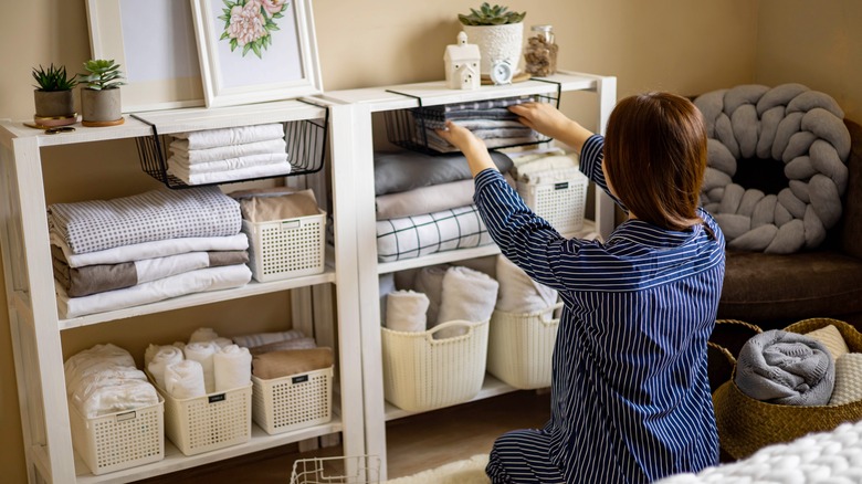 Woman organizing storage shelves