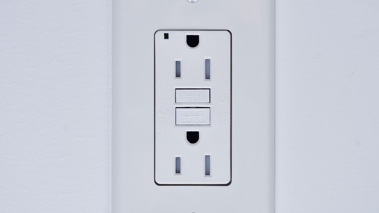 Close up image of an upside-down electrical outlet