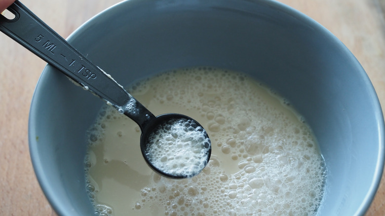 person making yeast mixture