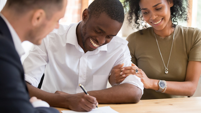 couple signing insurance policy