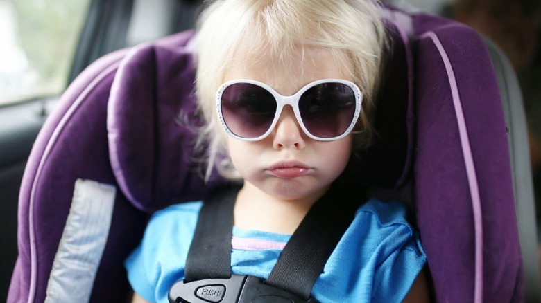 Bored toddler in carseat