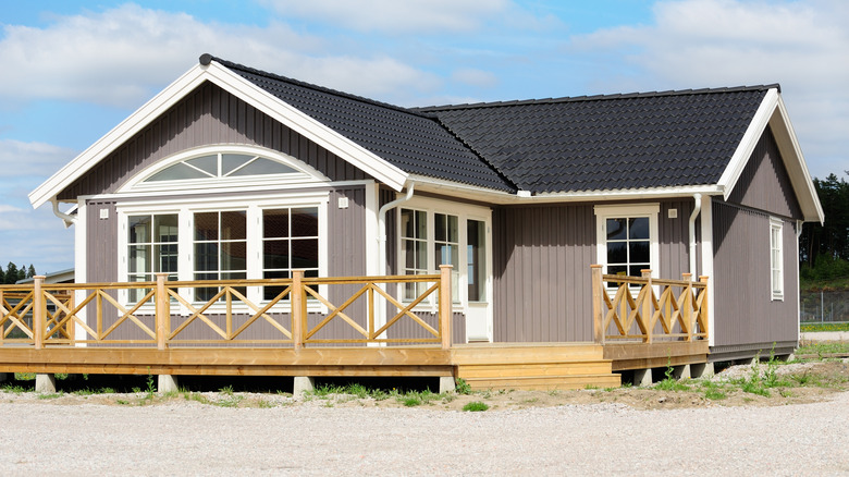 House with wooden porch and raised foundation