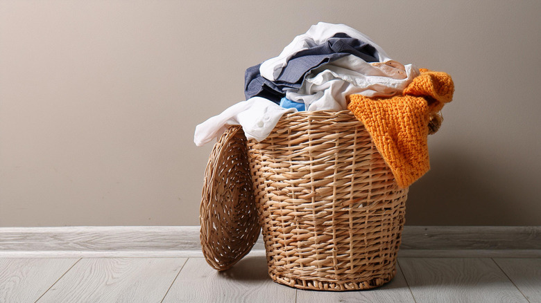 Laundry basket in modern home without laundry chute