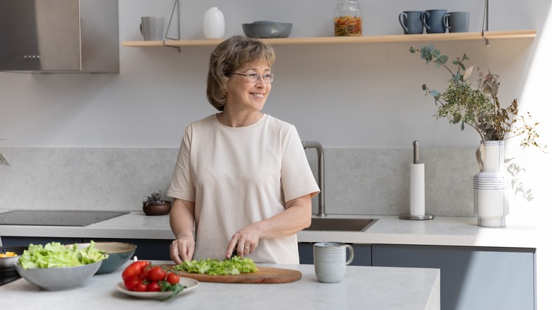 Woman looking away while cooking