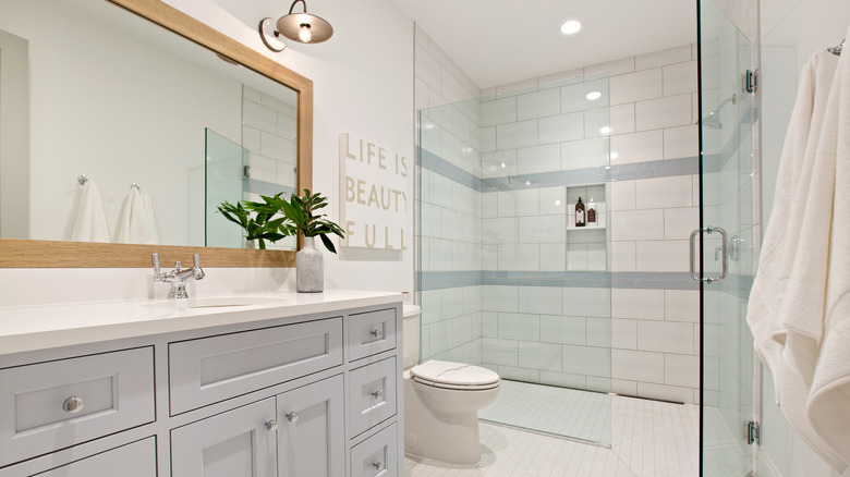 bathroom with tiled shower