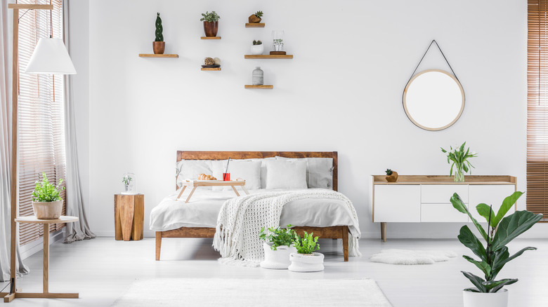 Spacious white and wooden bedroom