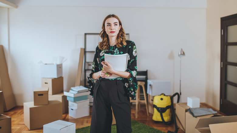 Woman and boxes during renovation