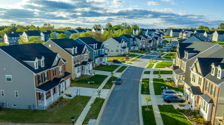 Road winding through residential homes