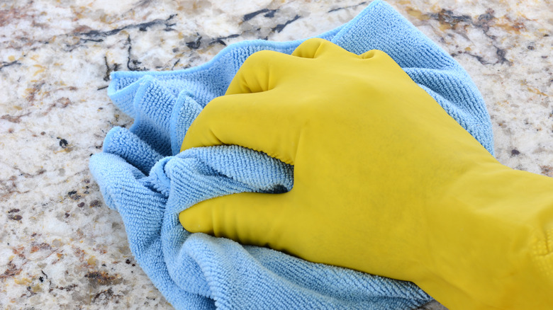 counter being wiped with cloth