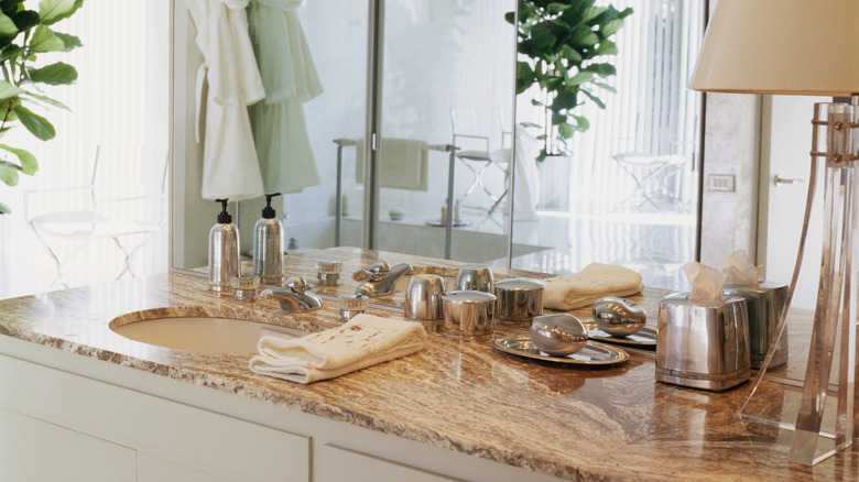 bathroom vanity with brown countertop