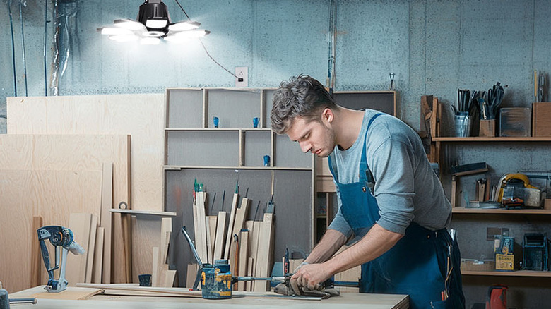 A garage workshop lit by diffuser LED lights