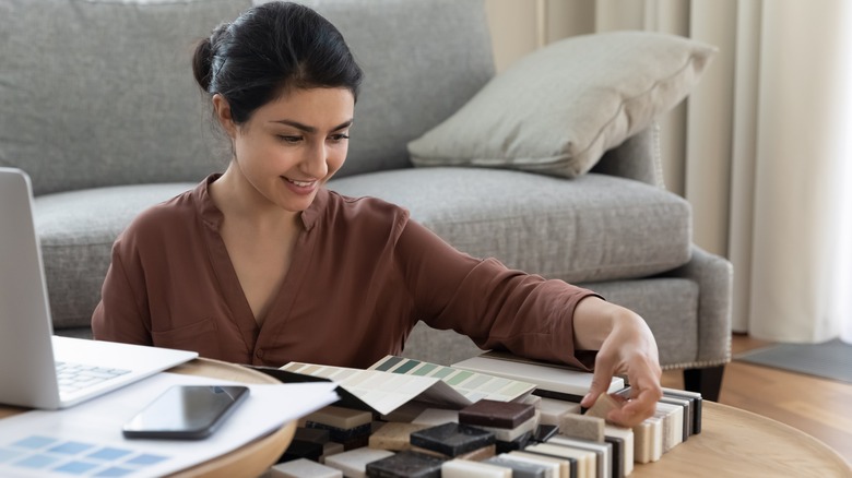 Woman looking at marble samples