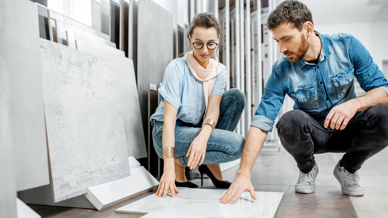 Couple looking at porcelain tiles