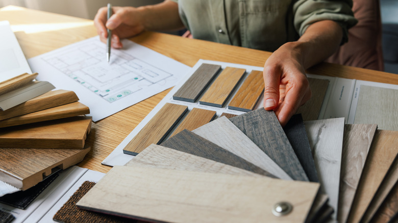 Designer looking at different flooring samples