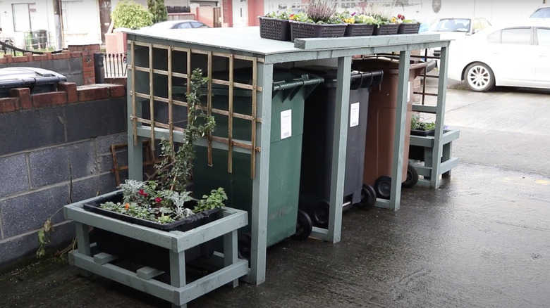 trash can shed with garden