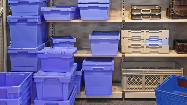 Different types of plastic bins for garage storage