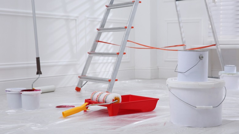 Metal ladder with red paint can