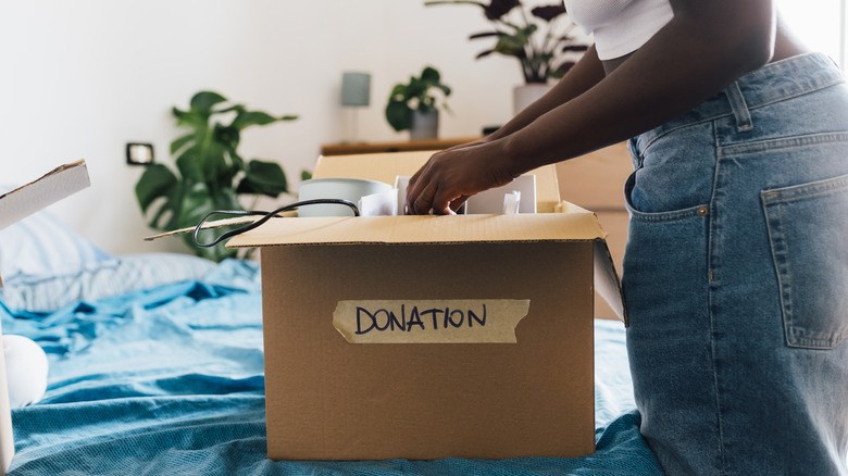 Person sorting donation clothes