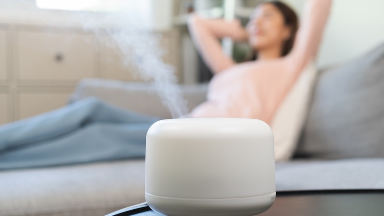 Woman enjoying humidifier