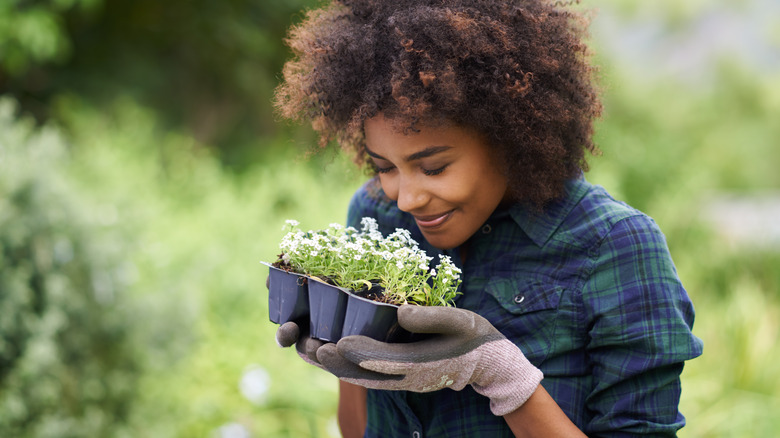 smiling woman holding flowers