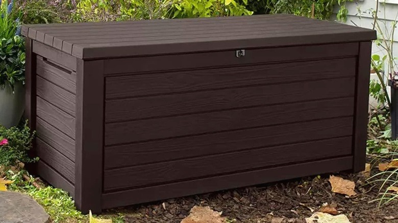 Keter 165-gallon deck box sitting in dirt