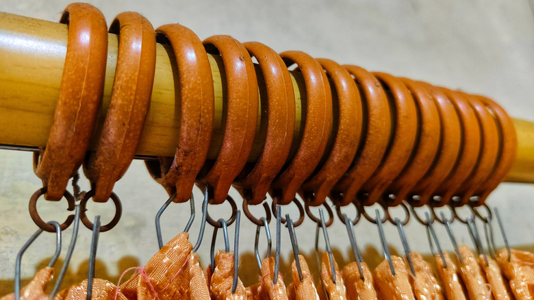 Rings on a wooden curtain rod