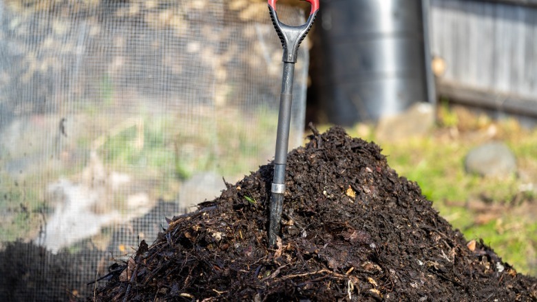 Compost pile with shovel sticking out 