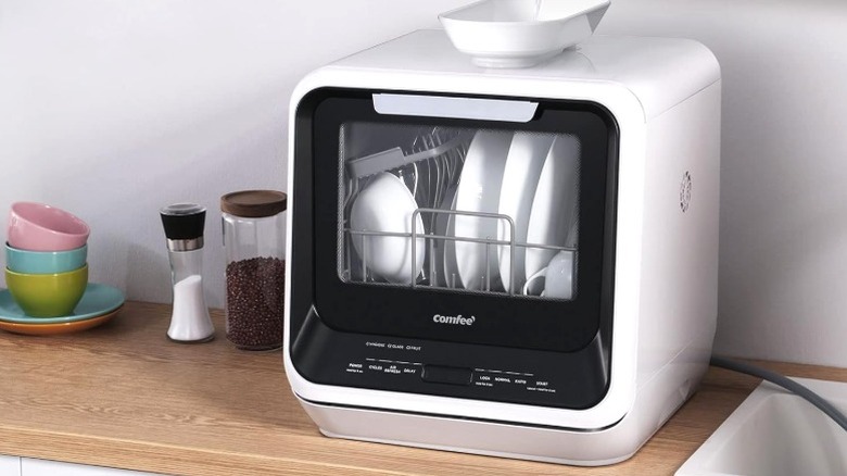 Comfee' portable mini dishwasher on countertop