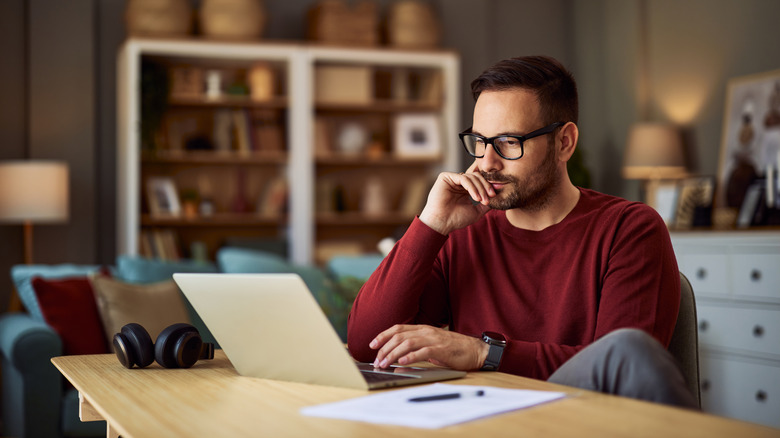 Person working from home with brown walls