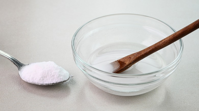 baking soda with water to form a cleaning paste