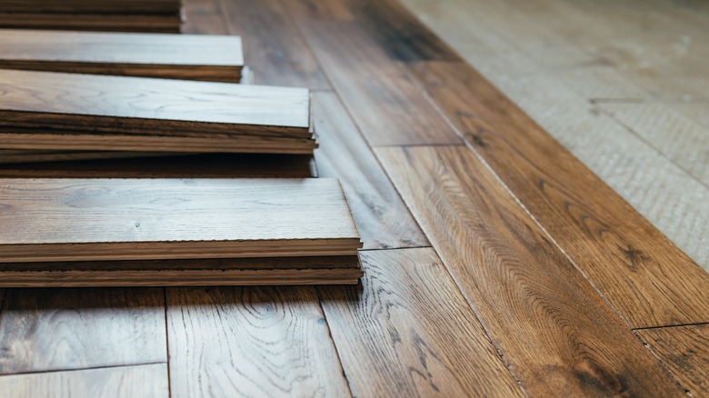 Oak floorboards stacked to assemble