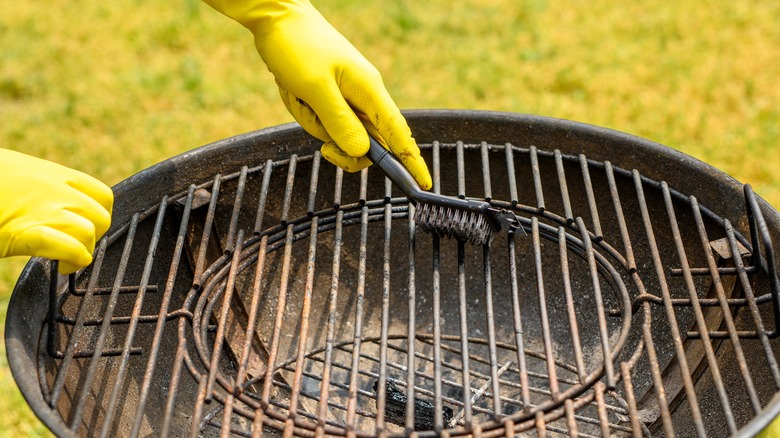 hand holding grill brush